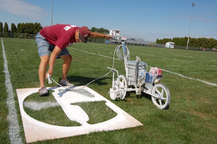 Countdown to kickoff: Painting the field a time-consuming, but fun job